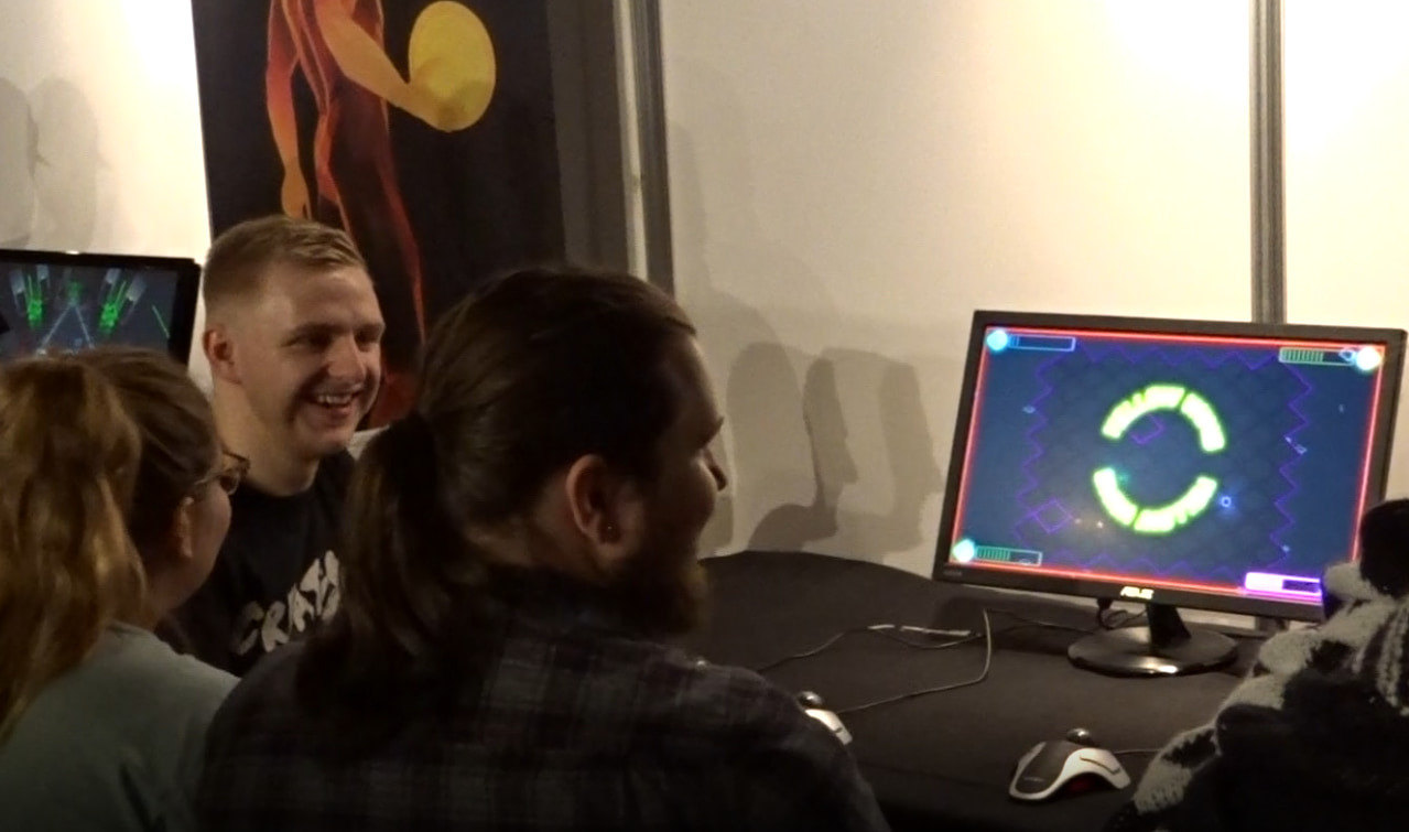A photo showing a group of people playing Cyber Sphere at the Resonate event.