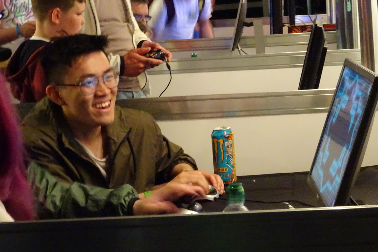 A photo showing a person playing Cyber Sphere at the Resonate event.