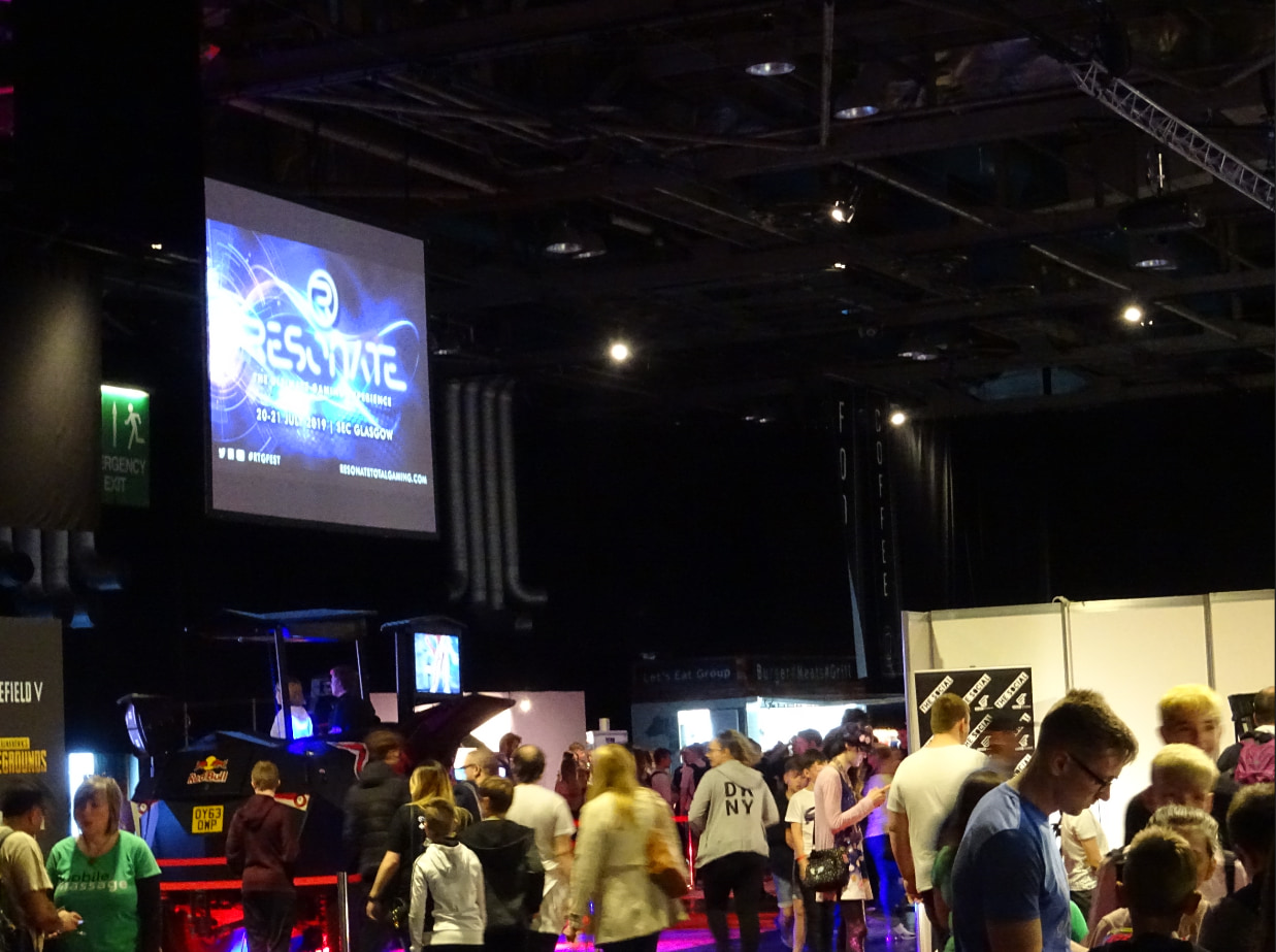 A photo showing a large overhead display at the Resonate event.